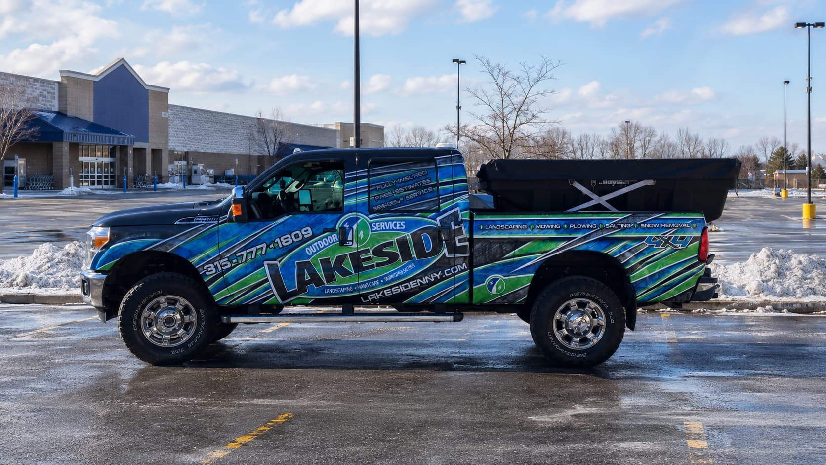 Lakeside Outdoor Services truck with salt spreader serving Watertown, Fort Drum, and the Thousand Islands